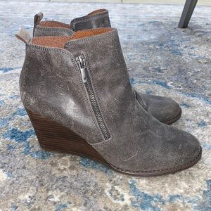 Distressed Lucky Brand wedges with zippers. Size 9. Leather upper. Lightly worn